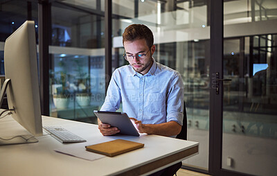 Buy stock photo Business, communication and overtime, man with tablet and computer at desk. Late night at office, working on deal or internet project. Corporate worker in glasses, checking online financial report.