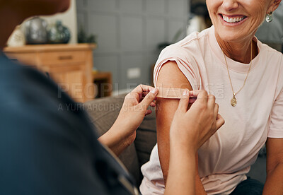 Buy stock photo Woman, smile and plaster after injection for vaccine against covid. Happy, senior and lady vaccination for coronavirus on sofa in doctor office for health, wellness and safety from global pandemic