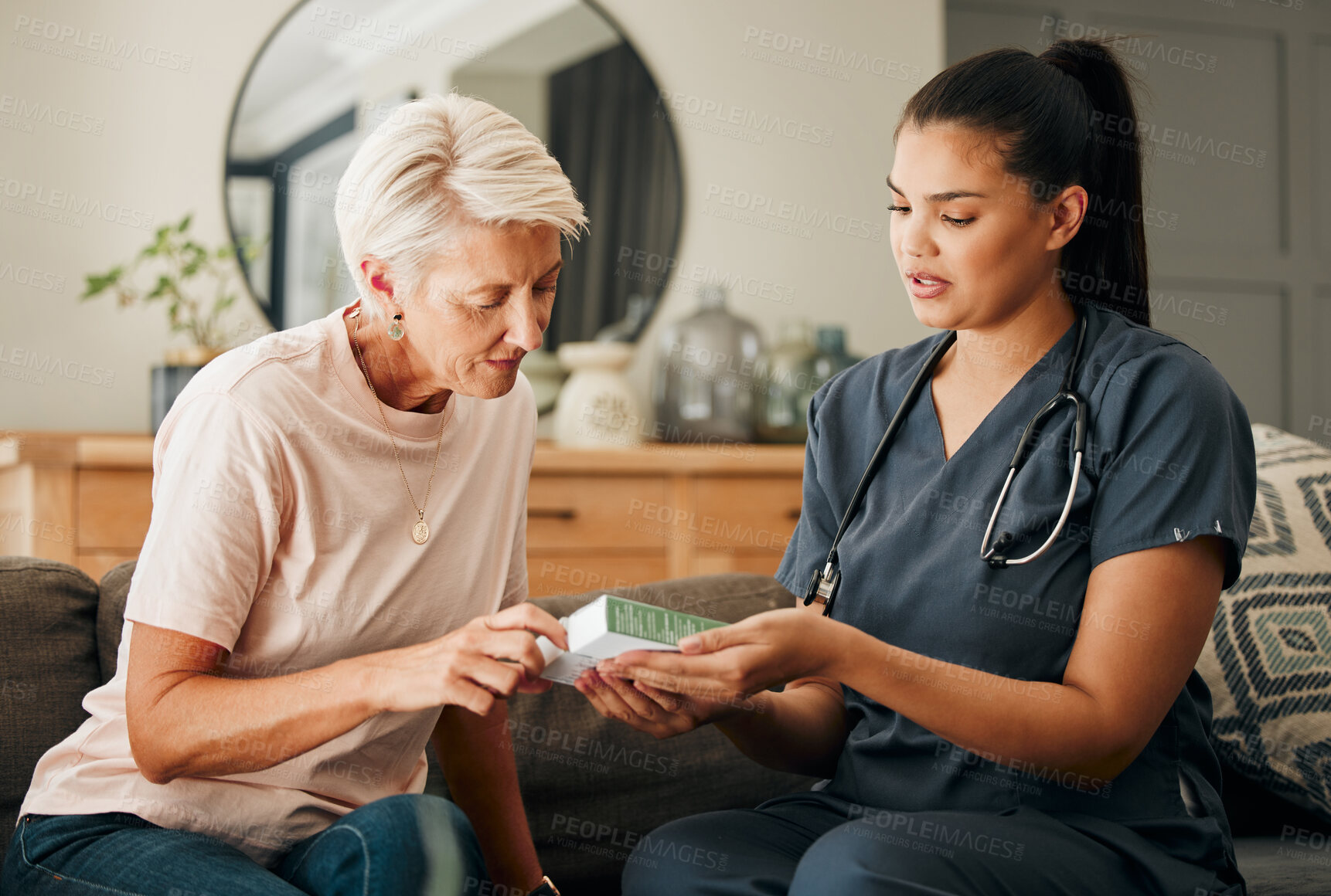 Buy stock photo Home, healthcare and doctor help elderly patient in assisted living care facility, explain medicine on a sofa. Support, pills and senior care checkup with nurse discuss option and recovery treatment