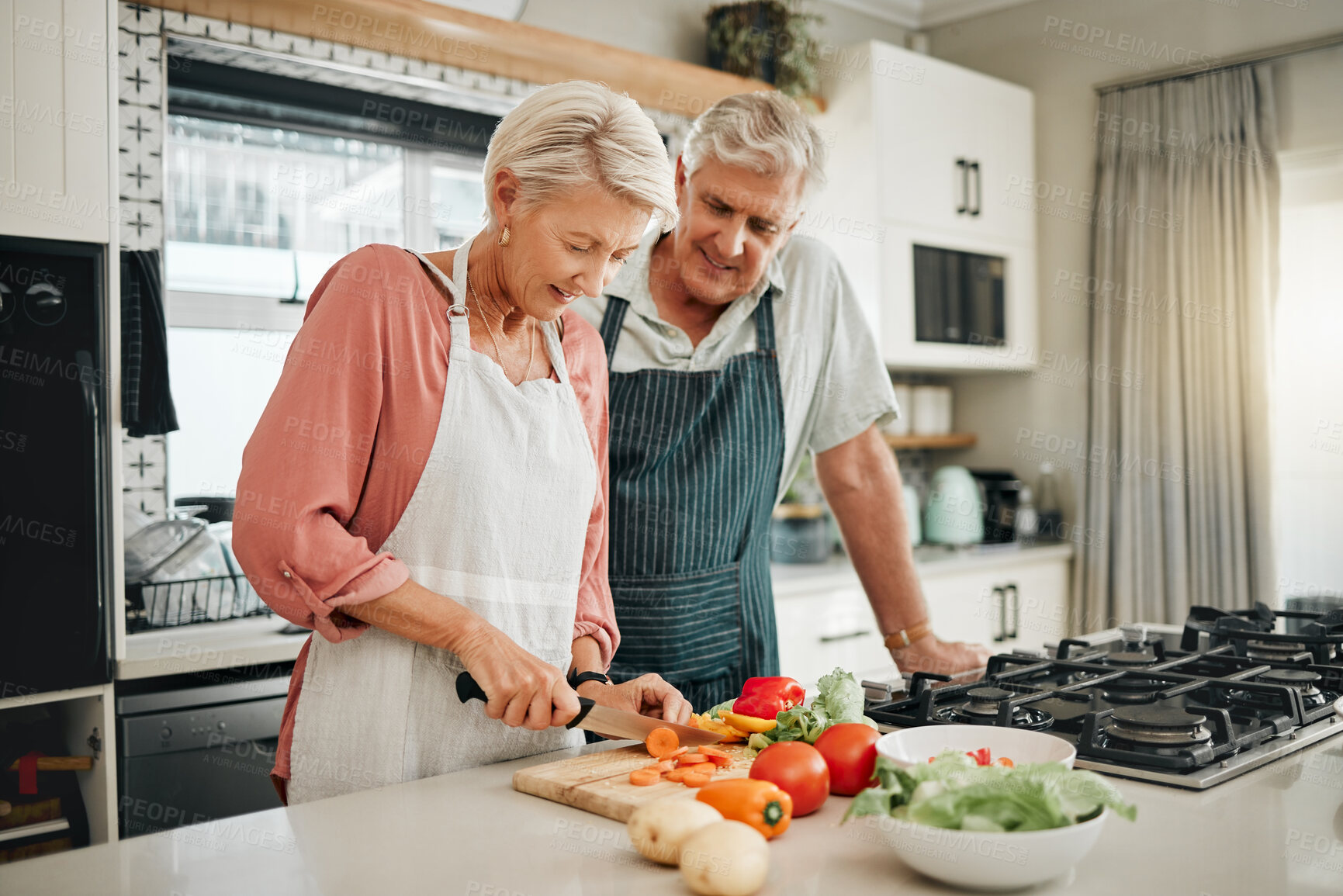 Buy stock photo Senior couple, healthy food and cooking lunch together in Australia kitchen at home. Happy woman, hungry man and retirement people cut vegetables for nutrition diet, wellness and vegan dinner meal