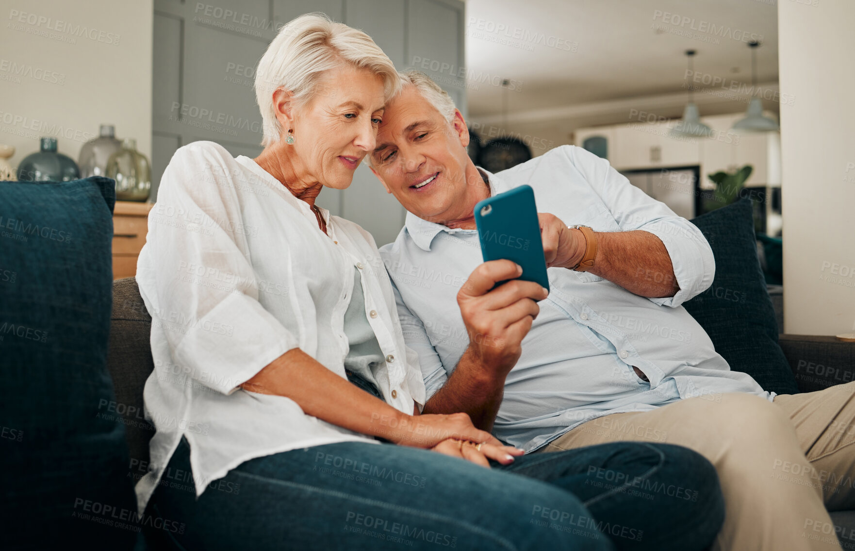 Buy stock photo Phone, love and senior couple on social media sharing news, gossip and online content together relaxing at home. Old man online shopping showing his elderly wife a sales offer, discount and deal