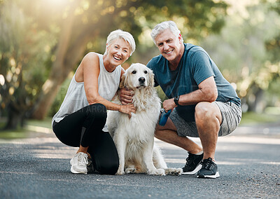 Buy stock photo Happy senior couple, walking dog in nature park and smile bonding with their golden retriever together. Healthy living in retirement, being physically active by exercising and relaxing time with pet 