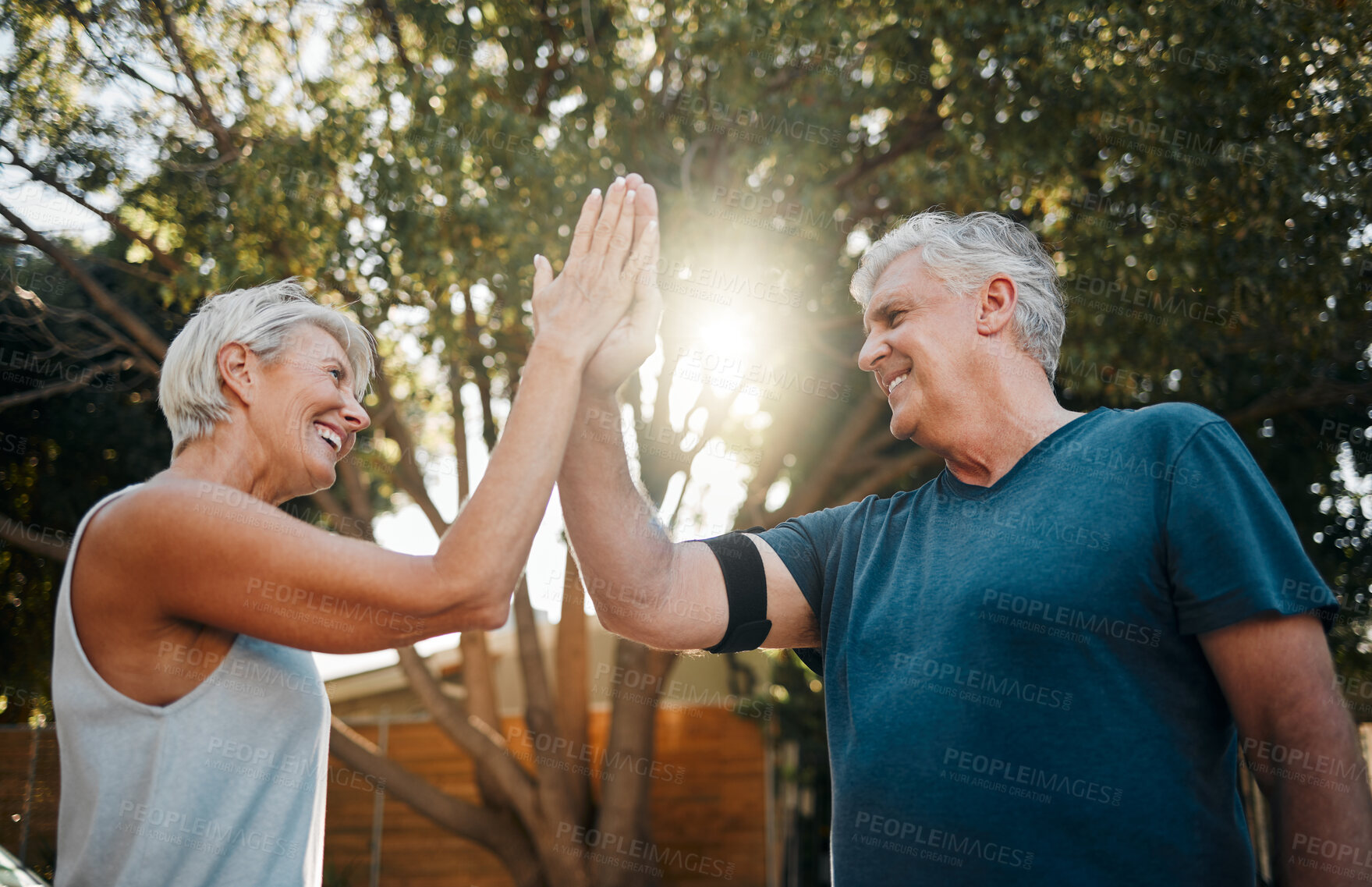 Buy stock photo Fitness senior couple high five for support, teamwork and exercise motivation with sunshine, outdoor exercise and wellness. Success, achievement or target goal of elderly people for workout results