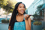 Black woman, speaker phone call and voice speech on microphone in Jamaica city street outdoor. Young millennial urban girl smartphone talking, loud audio chat ai application and mobile mic connection