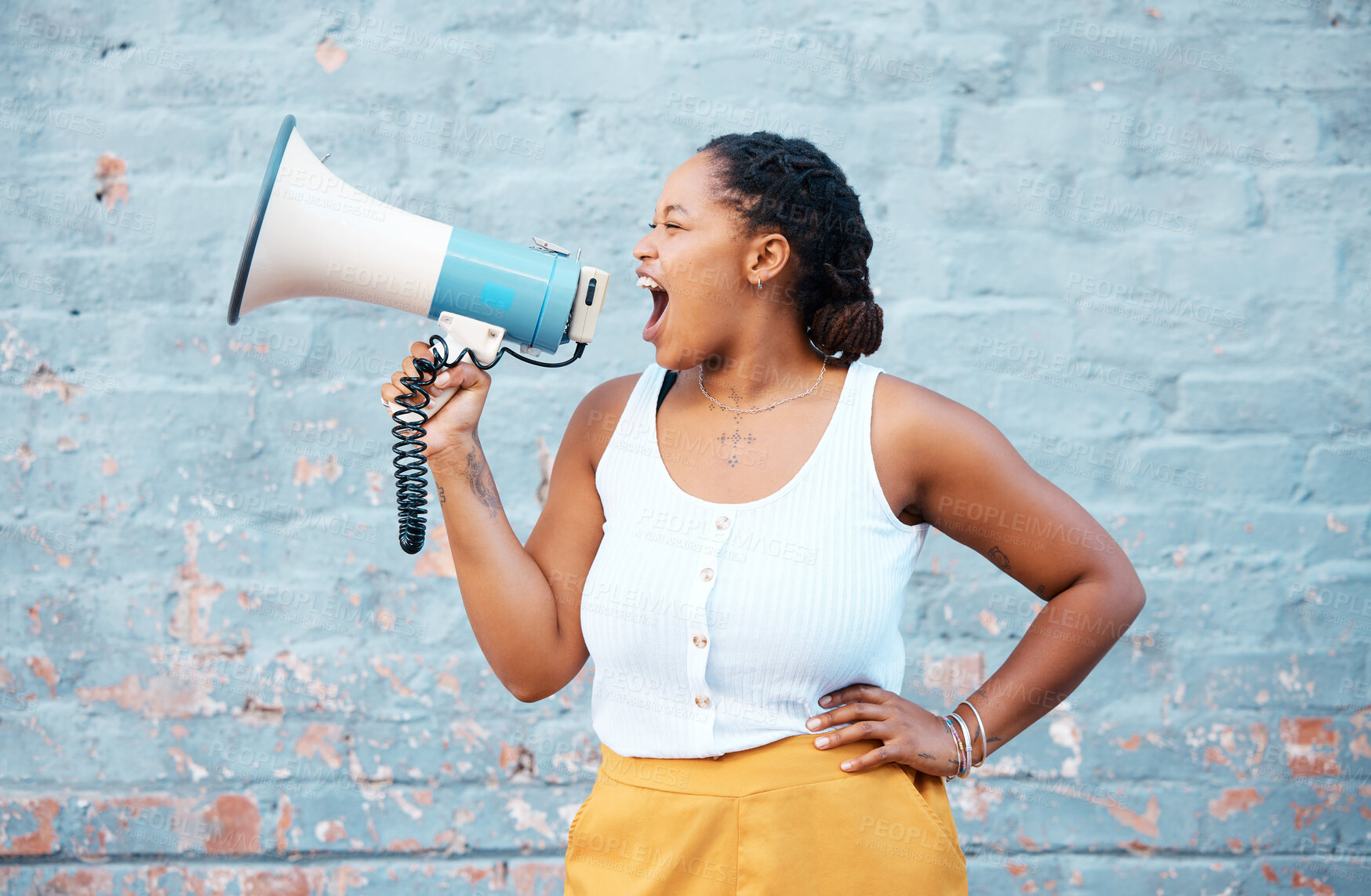 Buy stock photo Black woman, megaphone speaker and announcement on wall background for speech, protest and angry voice. Feminist rally fight for human rights, justice and freedom, gender equality, society and news