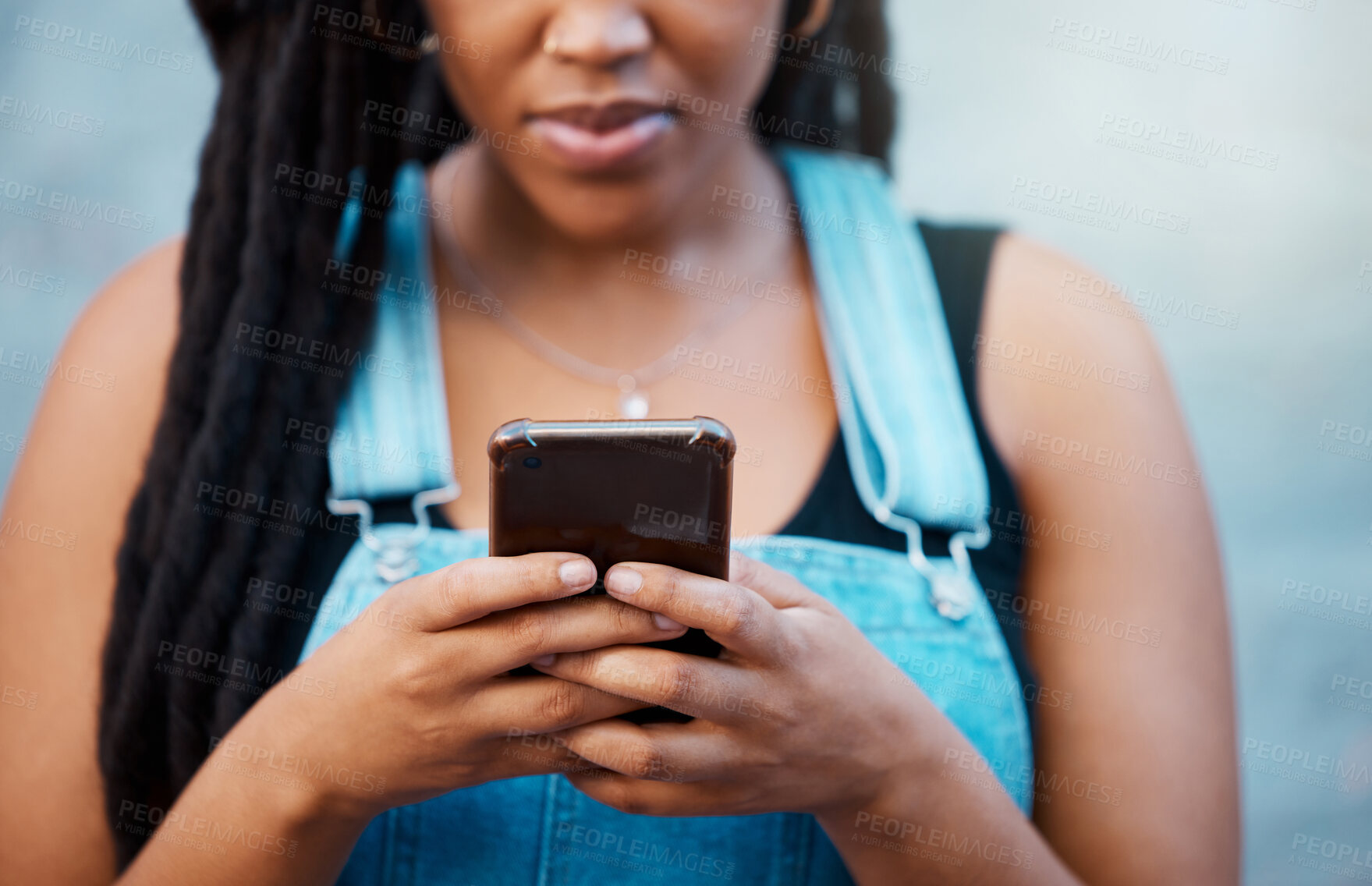 Buy stock photo Black woman hands with smartphone for social media, website contact information or reading online blog newsletter in youth urban lifestyle. Teenager with cellphone typing on chat app or 5g networking