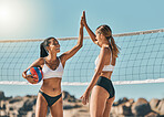 Volleyball, high five and winner with sports woman celebrating a win on the beach during summer. Teamwork, friends and goal with a female team in celebration of victory after a game while on vacation