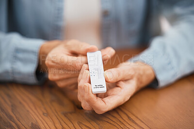 Buy stock photo Covid, healthcare and rapid antigen test in the hands of a man at home testing for infection and waiting for results. Health, medical and insurance with a testing kit for corona and examination