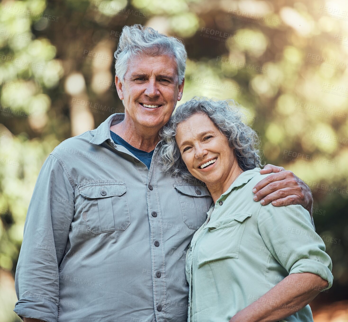 Buy stock photo Senior couple, love and hug in nature together for support, care and smile in outdoor park. Portrait of joy, happiness and elderly man and woman happy in retirement, romance and quality time outside