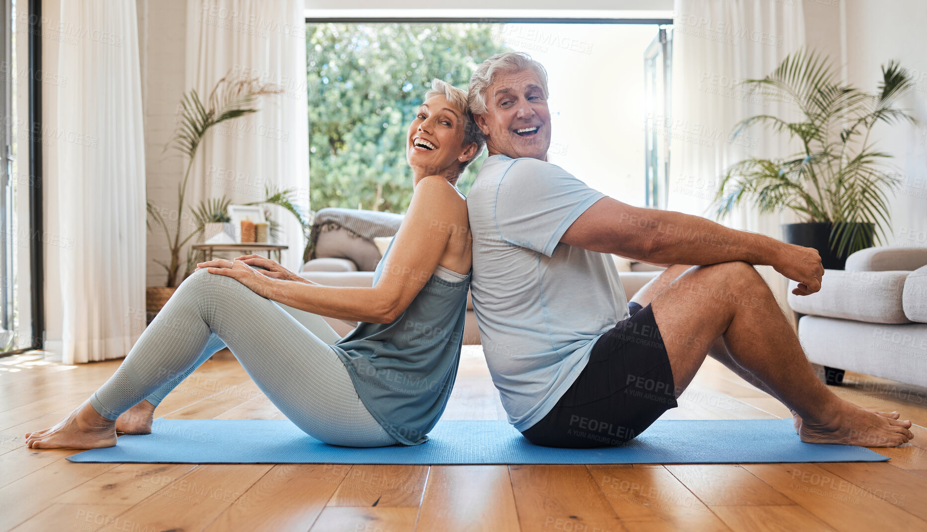 Buy stock photo Exercise, living room and happy senior couple stretching together on yoga mat on the floor. Fitness, pilates and elderly people with health, happiness and wellness lifestyle doing workout at home.