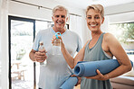 Old couple, yoga mat and water bottle in home ready for fitness, training and meditation. Zen, health and pilates exercise portrait of happy retired man and woman stretching, workout and wellness.
