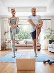 Mature couple, laptop and home yoga tutorial in house living room for body stretching, relax fitness workout and exercise training. Happy smile, zen woman and senior man with laptop for pilates class