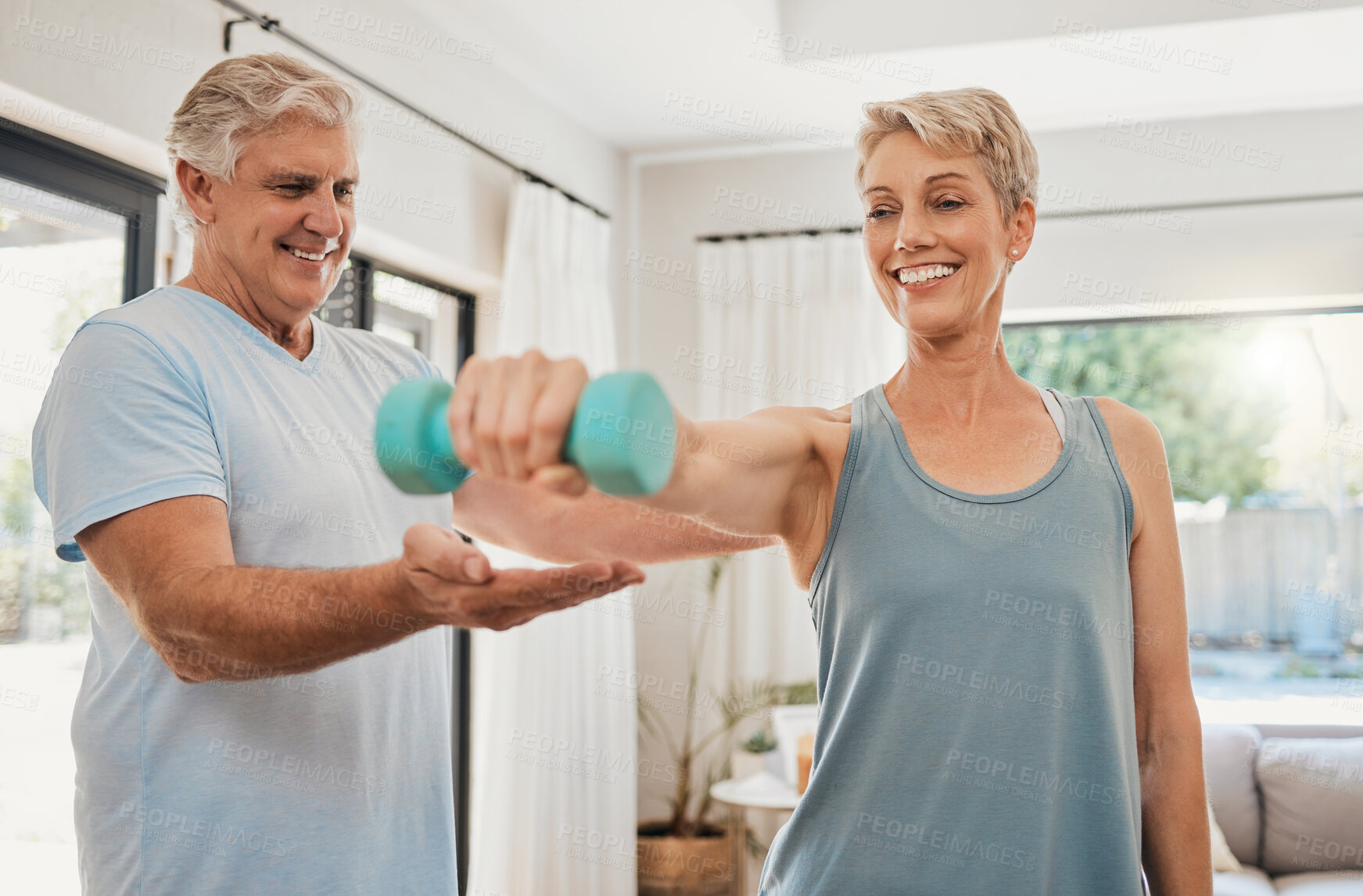 Buy stock photo Home workout, senior couple and dumbbell training exercise for fitness, wellness and healthy lifestyle in Australia. Happy elderly man help support strong woman with challenge, power and body muscle