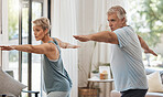 Senior couple, exercise and fitness during aerobics or yoga workout in the lounge at home for health and wellness in retirement. Old man and woman stretching for healthy lifestyle in Australia house