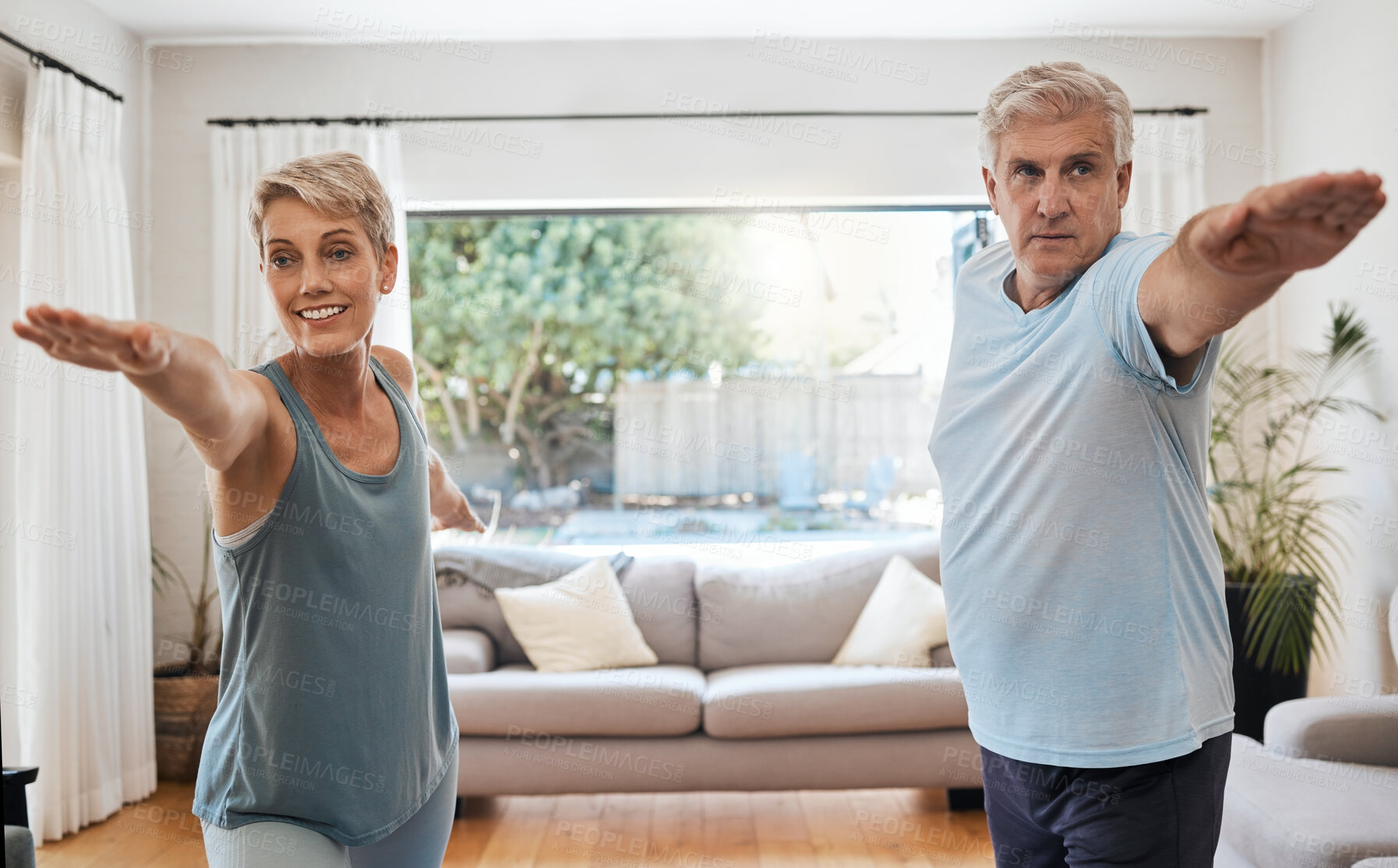 Buy stock photo Yoga, workout and senior couple doing exercise in their home to keep active. Old woman and man doing fitness training in their living room. Healthy lifestyle, wellness and stretching after retirement