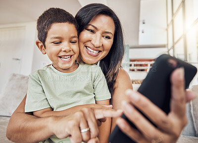 Buy stock photo Selfie, mother and son phone in living room on sofa smile, together and happiness on smartphone. Happy mom, boy child or kid love to watch internet online film or video streaming mobile app at home
