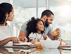 Happy family, breakfast and eating on table in home, talking or discussion together. Love, support and comic man, woman and girl child laughing, care and bonding drinking orange juice and having food