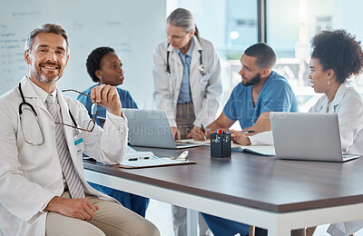 Buy stock photo Portrait of doctor with team in a meeting in the office, having a strategy discussion. Business meeting, teamwork and leadership in healthcare, working online using computers in the medical industry
