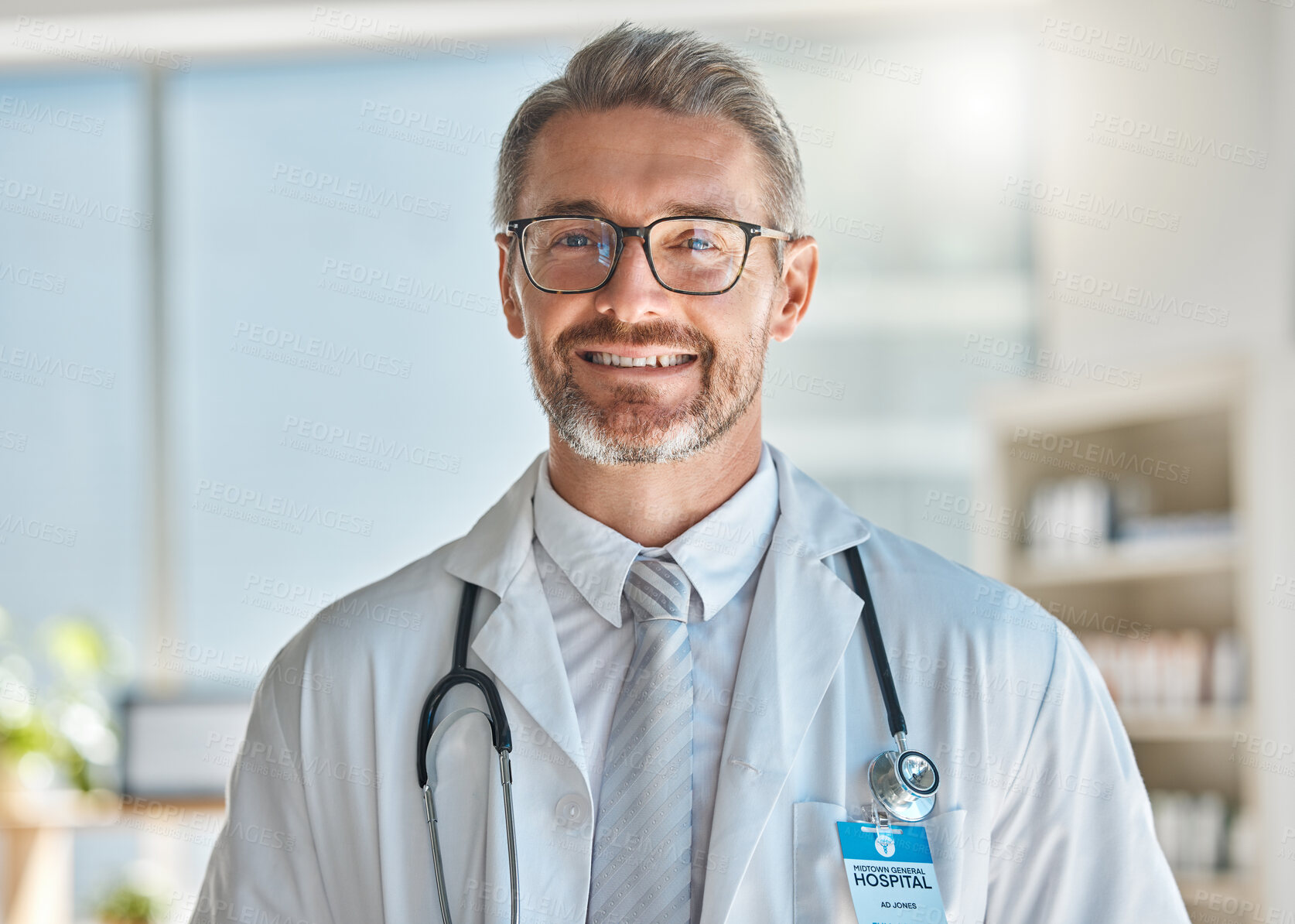 Buy stock photo Doctor, smile and office working at hospital, clinic or medical facility. Medic, man and happy at work with stethoscope, glasses and happiness on face in portrait at healthcare center in Atlanta