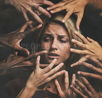 Buy stock photo Many hands, face and abuse with a woman victim feeling fear, alone or crying in studio on a dark background. Sad, pain and violence with a scared female suffering with stress or social anxiety
