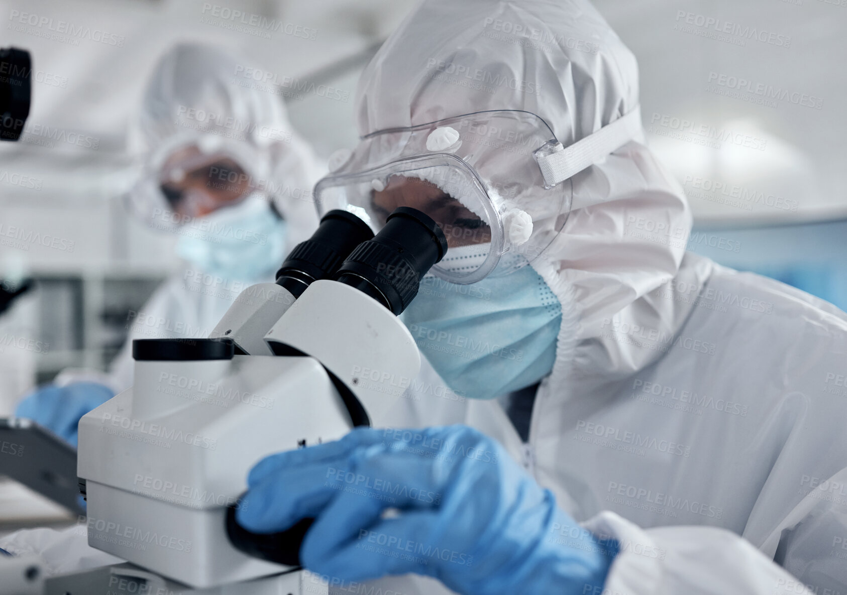 Buy stock photo Hazmat suit scientist, microscope and laboratory research analysis, dna test and vaccine development of medical bacteria risk. Science expert team, chemistry workers and healthcare analytics with ppe