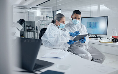 Buy stock photo Covid research, tablet and science with a man and woman scientist working in a lab for innovation and healthcare. Medical, internet and analytics with a medicine team at work in a laboratory