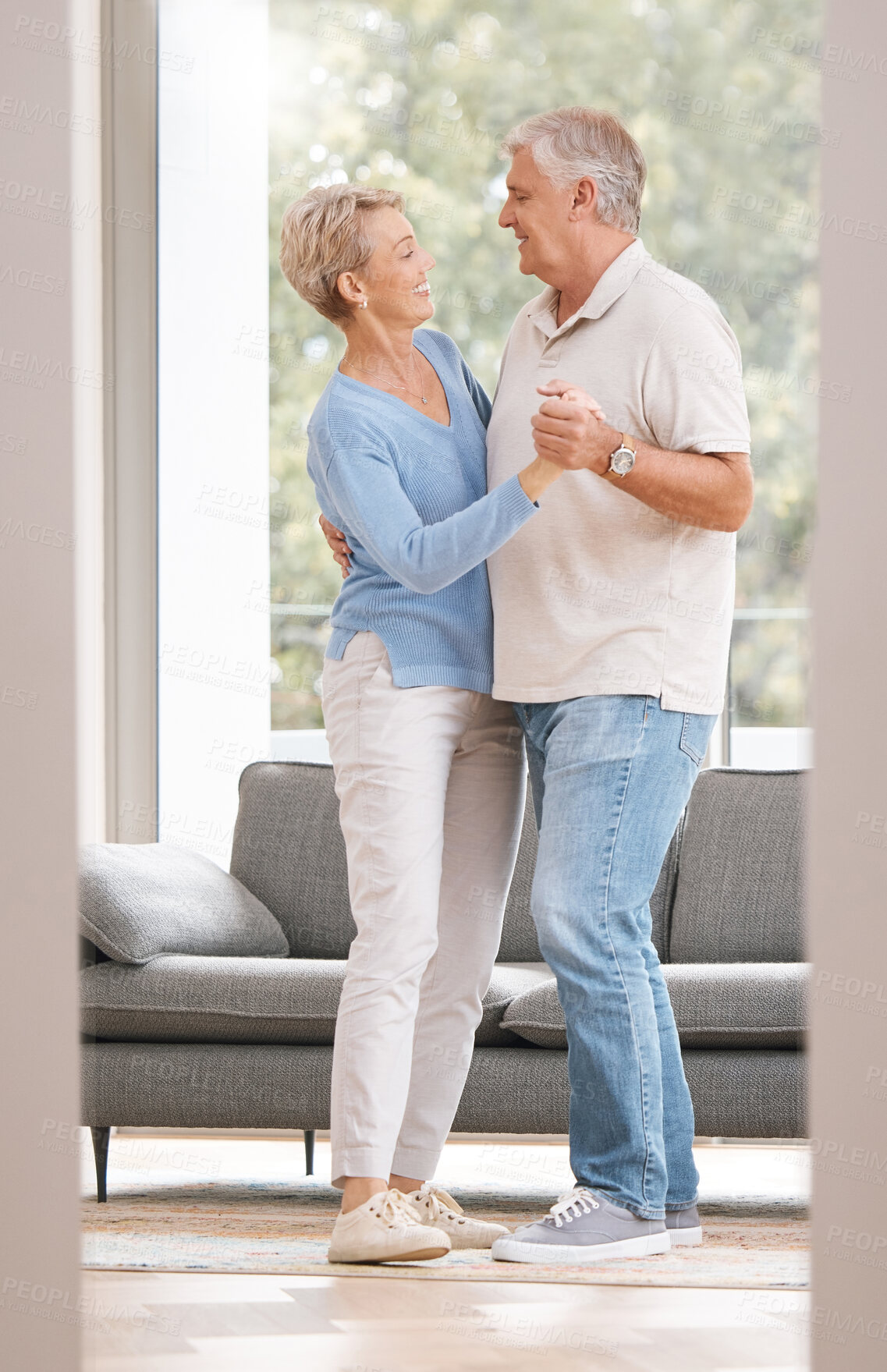 Buy stock photo Senior couple dance together for retirement, real estate or marriage celebration with happiness in new house. Elderly pension people dancing to music with love, care and wellness in living room