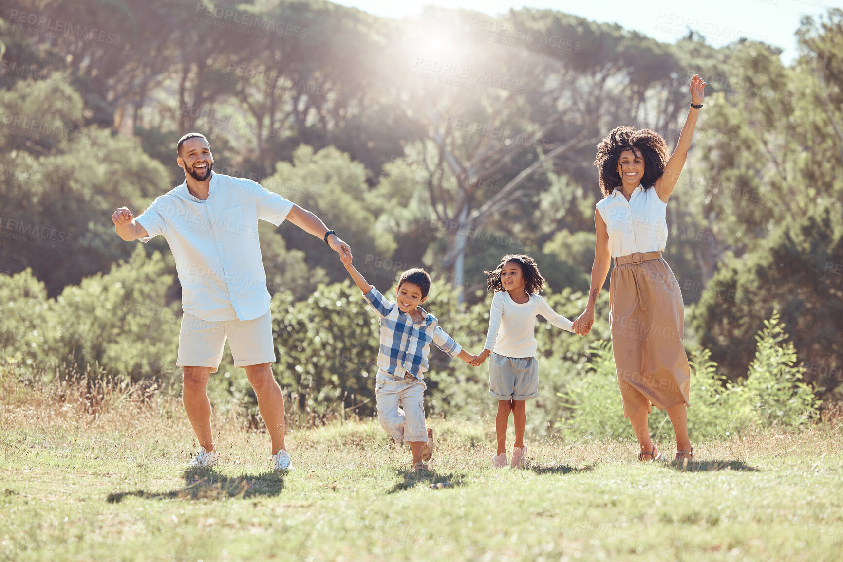 Buy stock photo Happy family, kids and walking in nature holding hands, spending vacation time together and bonding. Love, man and woman, children and outdoors park, forest or countryside walk with care and smile.