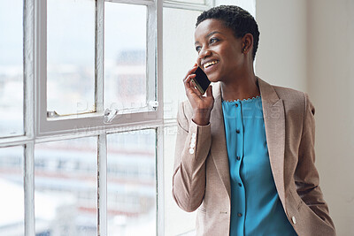 Buy stock photo African american business woman using smartphone talking on mobile phone looking out window