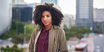 Portrait beautiful african american woman in city with afro hairstyle