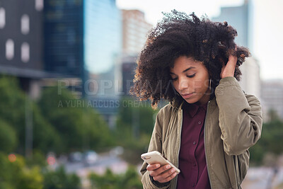 Buy stock photo African american woman using smartphone in city texting browsing messages on mobile phone technology