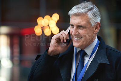Buy stock photo Mature businessman using smartphone talking on mobile phone call having conversation in city
