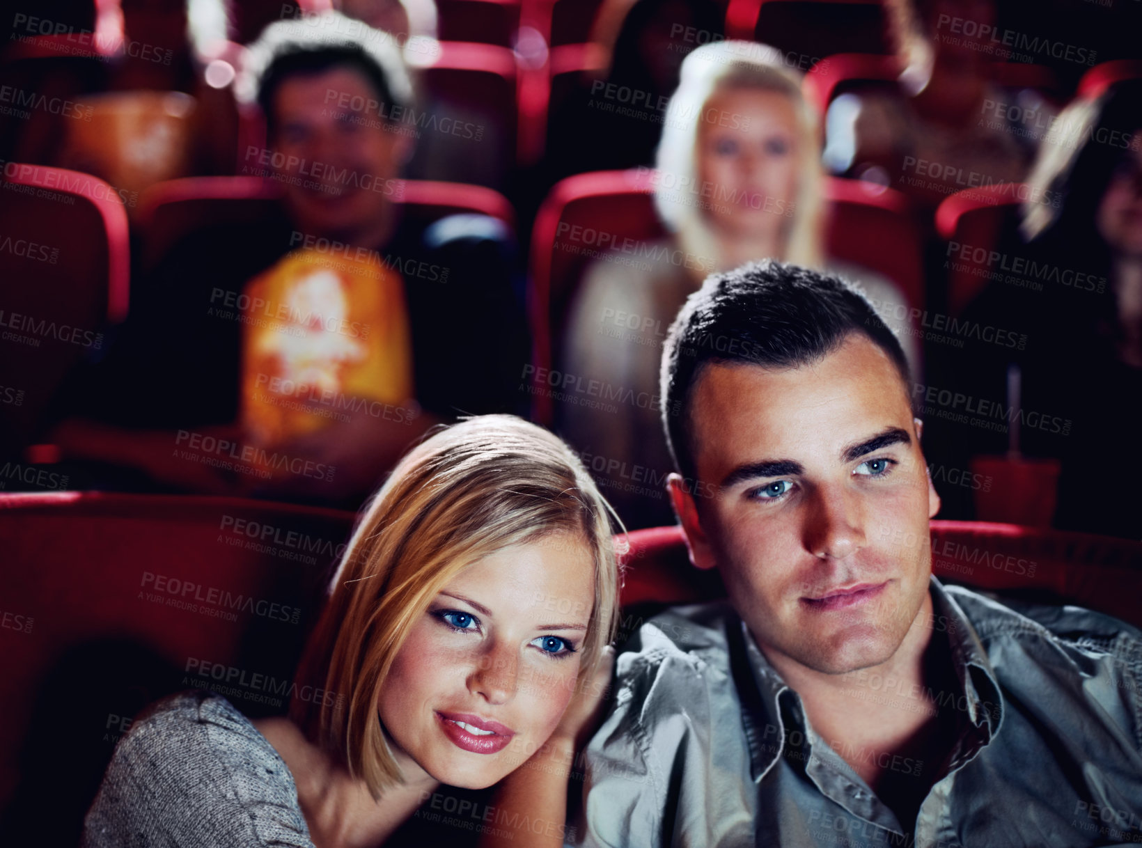 Buy stock photo Love couple at cinema or movie theatre to watch entertainment film together at movie theater on a romantic date. Young happy people smile, romance and relationship at movies cinematography theater