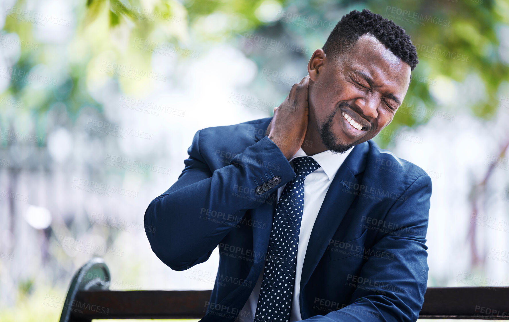 Buy stock photo Stress, burnout or pain and a business man with an neck injury in the city. Corporate worker in need of medical aid or emergency care after an accident sitting on a bench, overworked with a headache