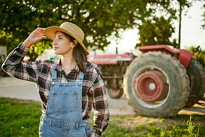 Buy stock photo Farm, tractor and a woman in a hat in nature or field farming food, fruits and vegetables. Agriculture and natural environment with farmer in the countryside in the summer sun working on harvest