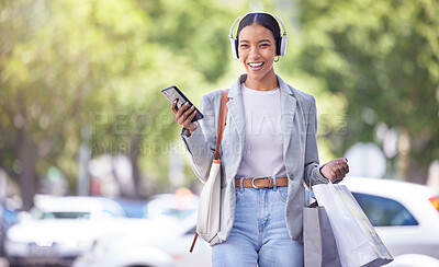 Buy stock photo Shopping in city, woman with smartphone and headphones listening to fashion clothes podcast with smile on face for marketing sale tips and style idea. Retail customer with an audio streaming service