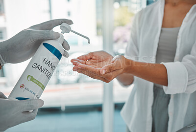 Buy stock photo Sanitizer or sanitizing woman cleaning her hands to prevent the spread of covid at the airport. Closeup of a female using antibacterial disinfectant for coronavirus protection in a modern building