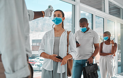 Buy stock photo Covid safety traveling, medical doctor with thermometer testing and screening or healthcare doing protocol checkup of people at airport. Travel nurse worker scanning during the corona virus pandemic