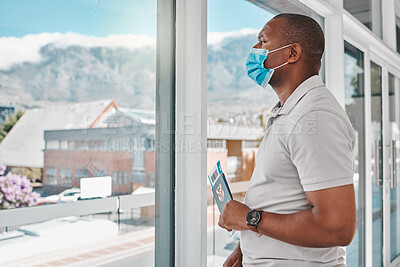 Buy stock photo Man at airport with covid passport and mask for safety from a virus waiting for flight during international travel. Tourist standing at window to board airplane for vacation during corona pandemic