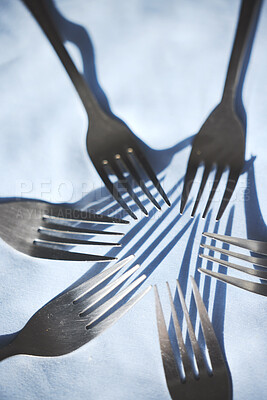 Buy stock photo Restaurant service and silver group of fork display on a table for catering service or food industry. Top zoom view of clean, metal or steel cutlery, kitchenware and kitchen tableware equipment