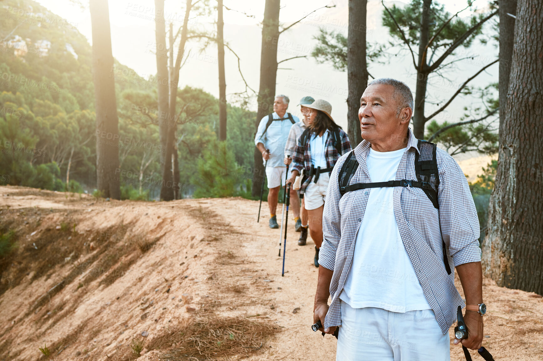 Buy stock photo Hiking, old and adventure seeking Asian man staying active, healthy and fit in twilight years. Tourists or friends travel doing recreation exercise and explore nature on wellness getaway or retreat