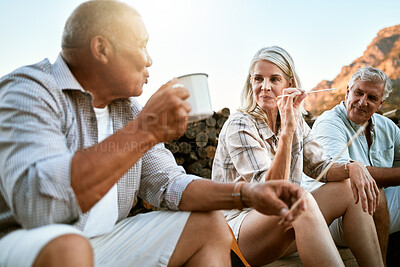 Buy stock photo Carefree, adventure and exploring friends talking, bonding and enjoying relaxing outdoors. Senior group enjoying a break after hiking in the forest, mountains or woods together having drinks or snack