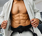 Sexy body of karate man, martial arts coach and strong personal trainer training for fitness in sports gym and health studio. Taekwondo warrior, bodybuilder and athlete for challenge, power and fight