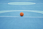 Basketball sport ball in empty basketball court to play, train and practice for tournament game and training day. Summer sports exercise and fitness workout training or practicing for competition