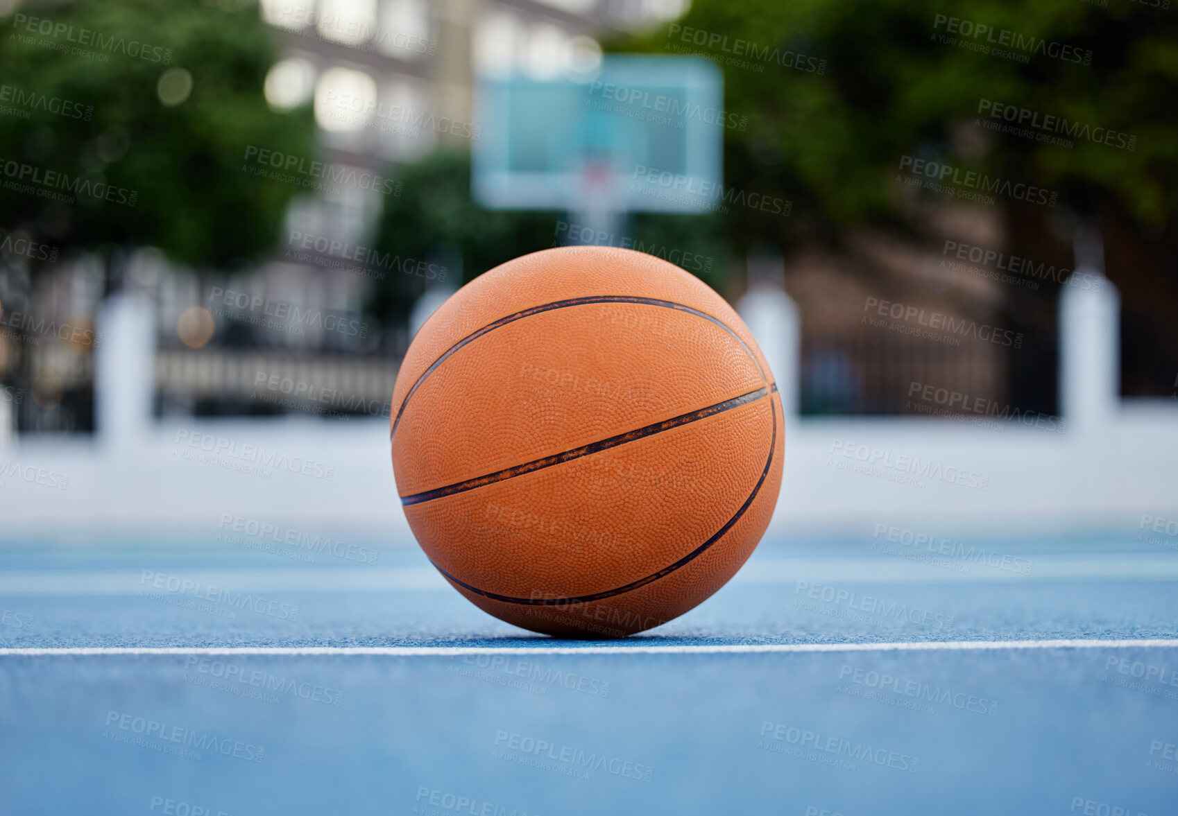 Buy stock photo Basketball on the floor of a sports court during training for a game in summer outdoors. Closeup of orange ball for athlete team to practice their strategy for fitness and exercise in outside stadium