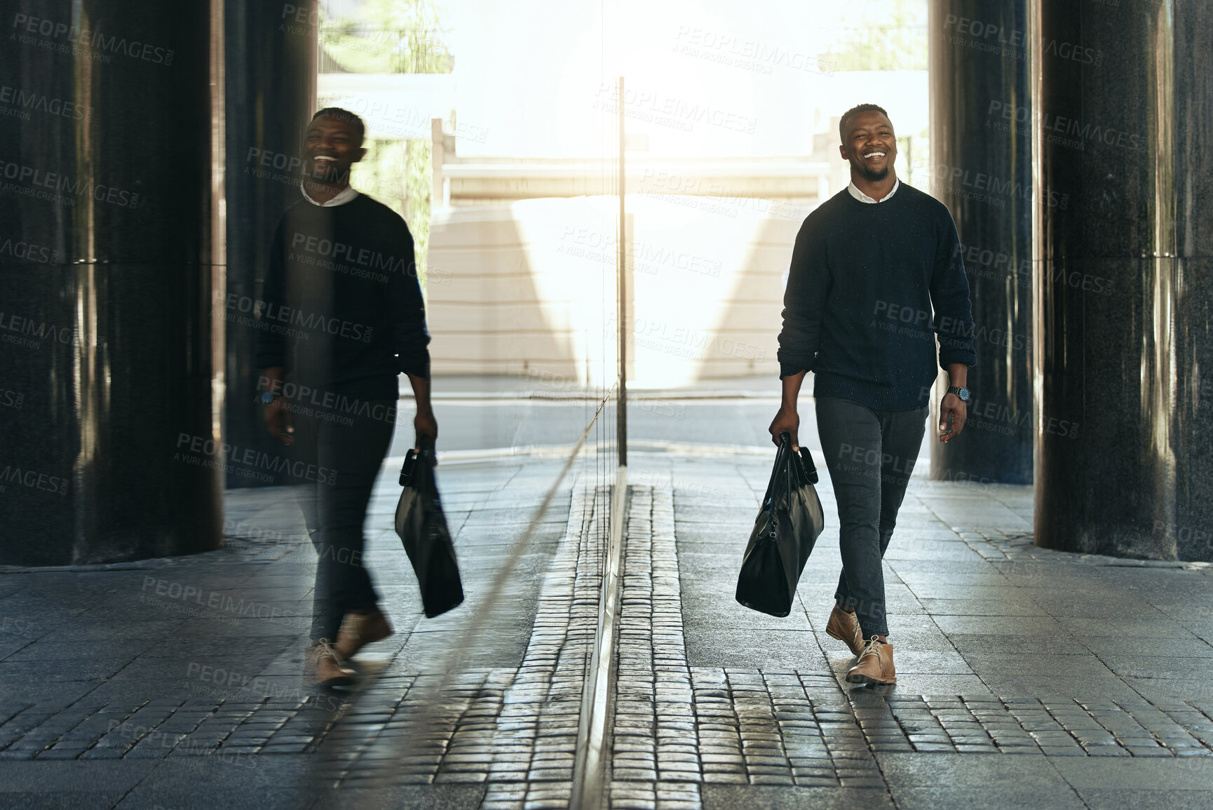 Buy stock photo Happy, travel and business man walking to work at corporate company in the city with dark aesthetic background and reflection. Smile of a black man or professional worker on a business trip with bag