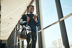 Travel business man getting email or social media notification while walking to work at corporate company. Happy professional reading a marketing discount newsletter for airport business class flight