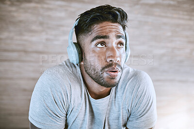 Buy stock photo Training, sports and fitness with athlete listen to music on headphones, getting ready to exercise. Sporty male on break, streaming motivation podcast online, doing breathing exercises before workout