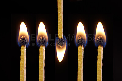 Buy stock photo Fire and flame burning on matches sticks as light in the dark against black studio background. Closeup detail of a row of five bright art or artistic matchsticks with flames lit for heat