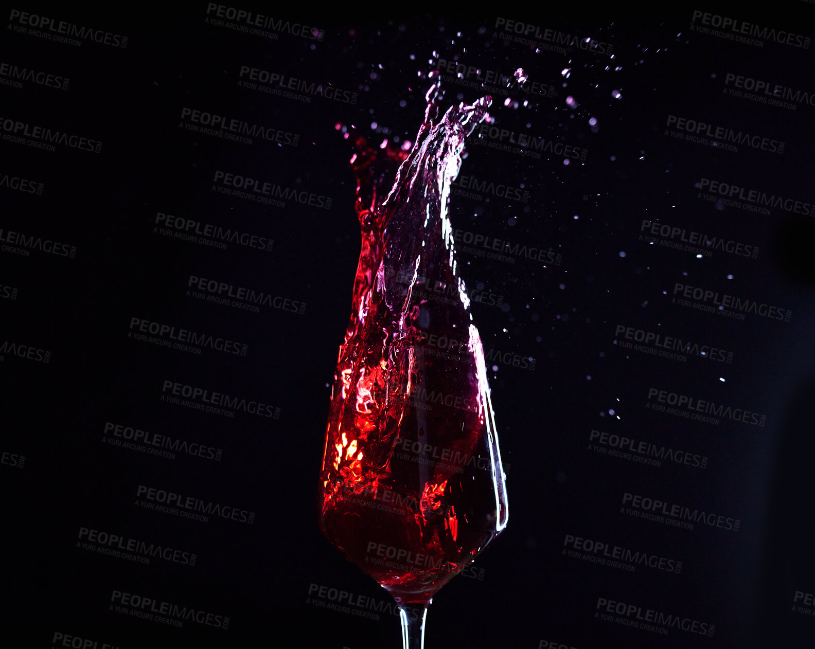 Buy stock photo Wine, alcohol or drink glass and splash on black studio background for celebration, cheers or restaurant toast. Zoom, red creative texture or fruit beverage in liquid motion at event or birthday